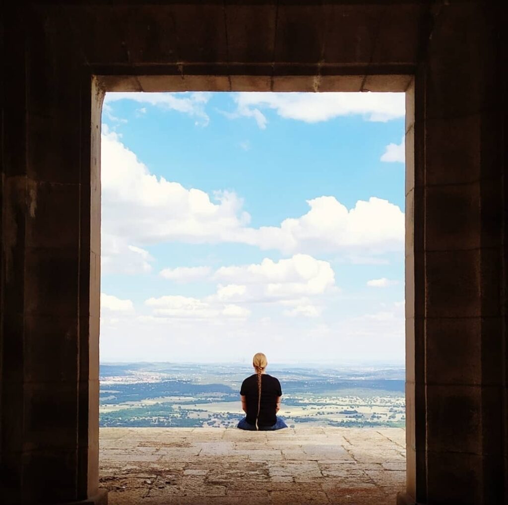 Translator and founder of Tuimala Traducciones Timo Tuimala sitting and looking at a view in the Via Crusis in Madrid.